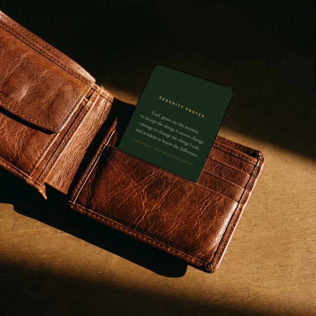 Green and gold recovery wallet card, dark background, in a wallet